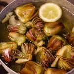 Take the artichokes, cut them into wedges and serve them ..